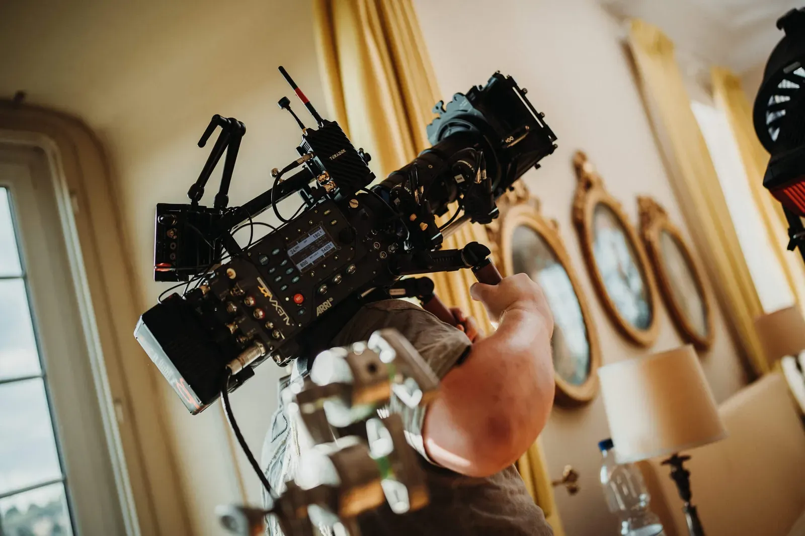Behind the scenes of a commercial shoot with camera and lighting equipment